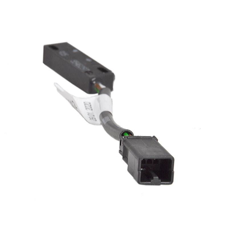 Grammer seat contact switch with black housing, 4-pin AMP connector, and protective wire sleeve on white background.