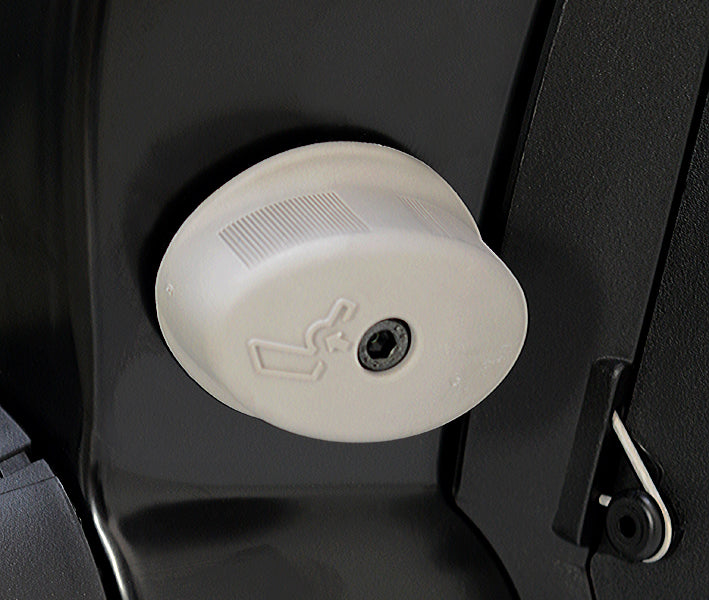 Light gray mechanical lumbar adjustment knob on a black Grammer 722 seat base frame.