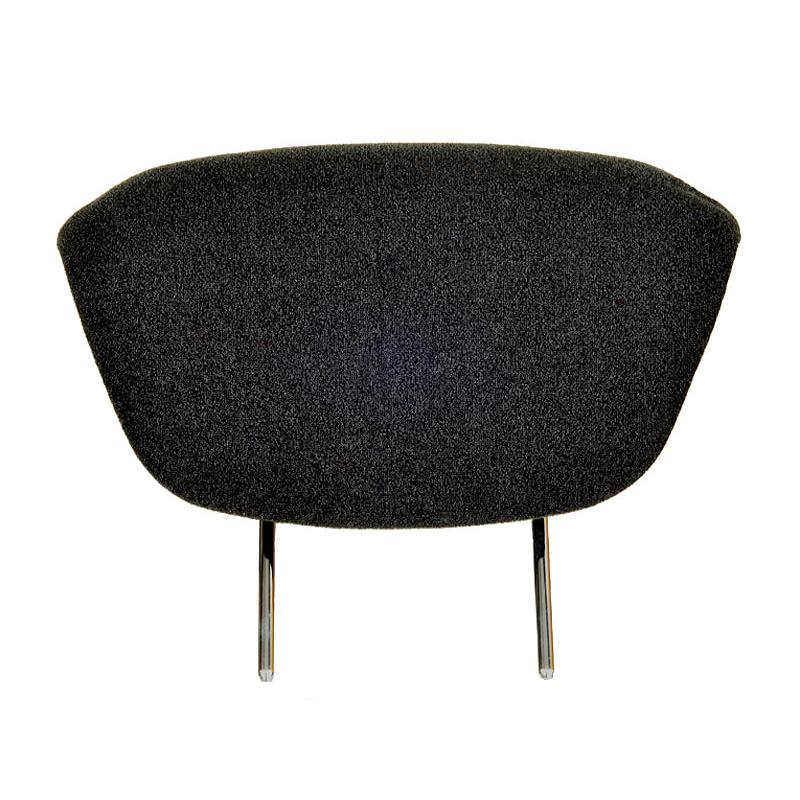Black vinyl Grammer seat headrest extension with an ergonomically contoured cushion and two adjustable steel mounting rods.