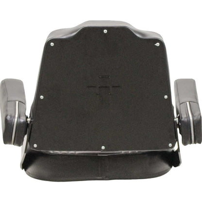 Black vinyl tractor seat assembly with tombstone backrest, folding armrests, and stamped IH logo on steel back pan.
