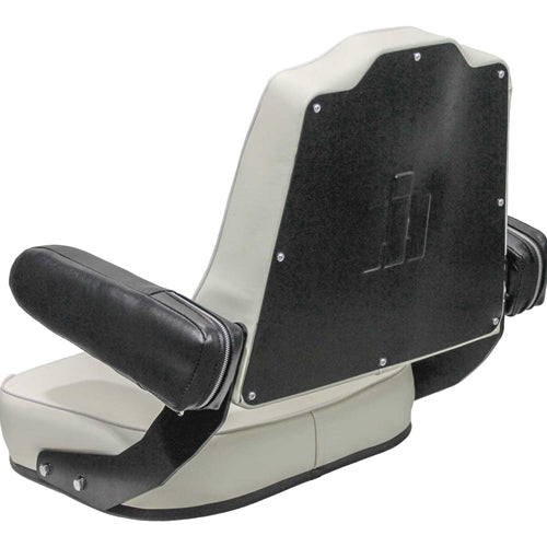 White vinyl tractor seat for International Harvester with black armrests and a stamped IH logo on the backrest pan.
