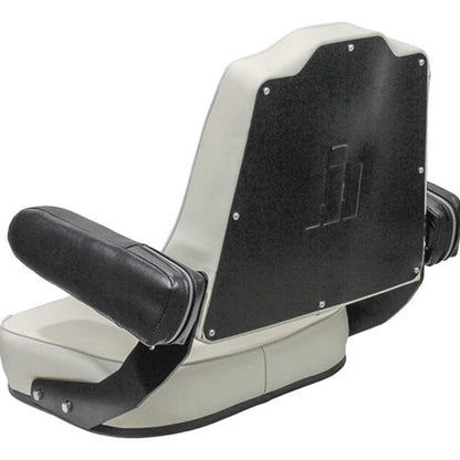 White vinyl tractor seat for International Harvester with black armrests and a stamped IH logo on the backrest pan.