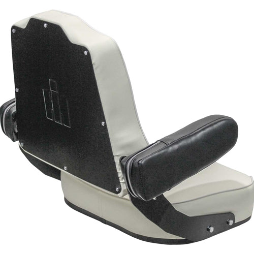 White vinyl tractor seat with black armrests and a tombstone-shaped backrest featuring an embossed IH logo.