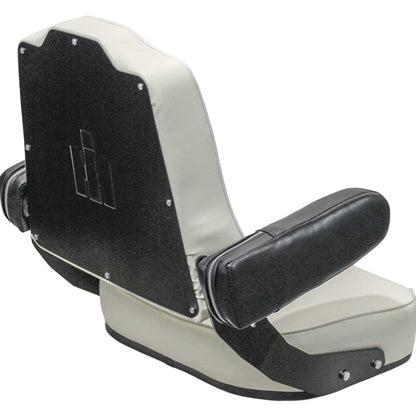 White vinyl tractor seat with black armrests and a tombstone-shaped backrest featuring an embossed IH logo.
